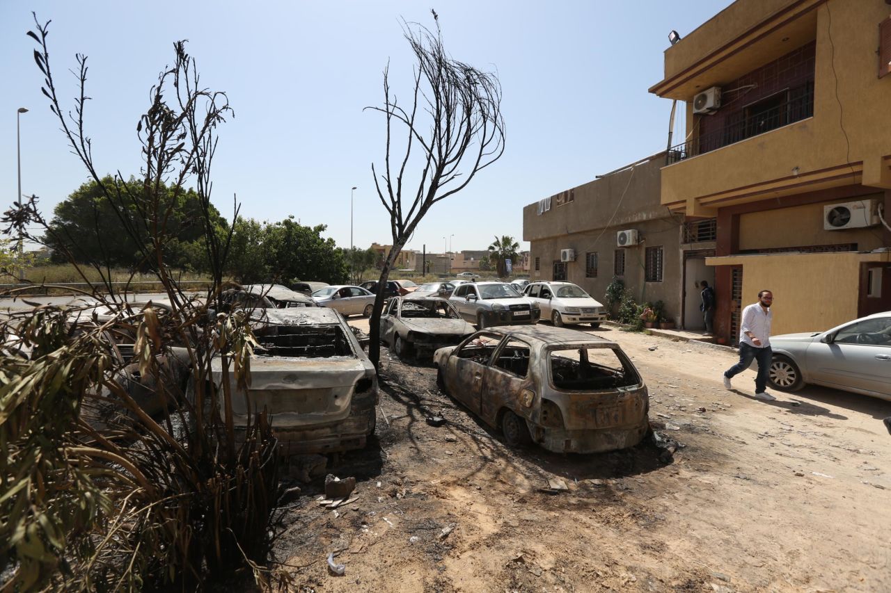 Damaged vehicles are seen after forces led by Haftar carried out rocket attacks in the Abu Salim neighborhood in Tripoli on April 17.