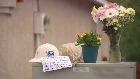 Flowers and a note were placed outside the home where the shooting happened.