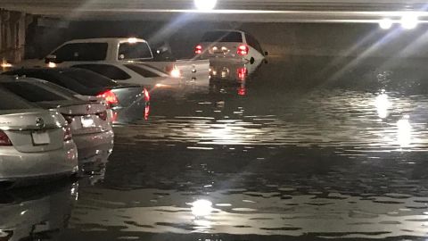 Flooding covered some cars up to their roofs in a Dallas Love Field Airport parking garage.