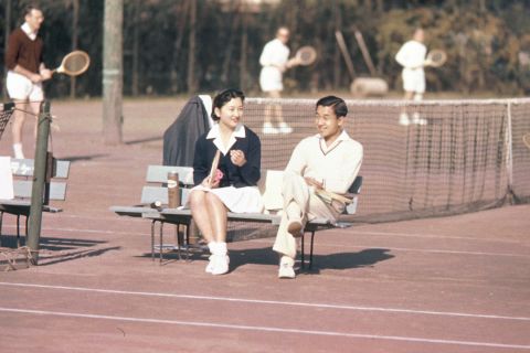 Akihito, then-Crown Prince, and his fiancée Michiko Shoda photographed at the Tokyo Lawn Tennis Club on December 6, 1958. The couple had met the previous year while playing a doubles match on a tennis court in Karuizawa, Nagano prefecture, an event that became known as "love match." 