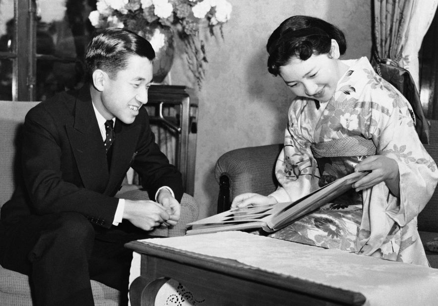 Akihito watches his then-fiancée, Michiko Shoda, flip through a photo album at his Tokyo mansion on December 26, 1958. Shoda was nicknamed "Mitchi" and her hairstyles and fashion were closely watched. "Japanese women adored her," said Yukiya Chikashige, a journalist who has covered the Japanese royal family for over three decades. "Her image was similar to Princess Ann (Audrey Hepburn's character) in 'Roman Holiday.'''