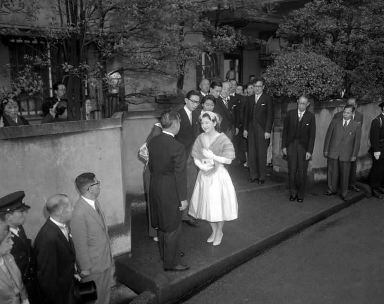Michiko Shoda, now known as Empress Michiko, departs her home for the Imperial Palace in the early hours of April 10, 1959, the day of her marriage to Crown Prince Akihito. "This was a marriage for love, and between a royal and a commoner," said Chikashige. "It was new to the public." 