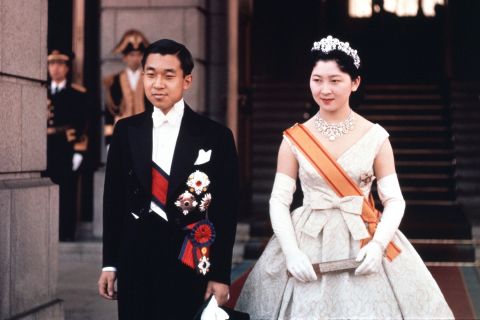 Akihito and Michiko pose for photographs at the Imperial Palace the day after the royal wedding. "The distance between the imperial family and ordinary people shortened dramatically with the marriage," said Suzuki.