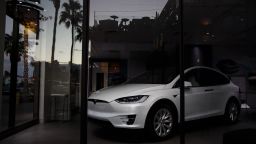 A Tesla Model X electric vehicle sits inside of a closed Tesla Inc. store in Palm Desert, California, U.S., on Thursday, March 7, 2019. Tesla has cut prices of the Model 3 and its other vehicles several times this year to offset the lower incentives, most recently by announcing a plan to close most stores and shift all ordering online. Photographer: Patrick T. Fallon/Bloomberg via Getty Images