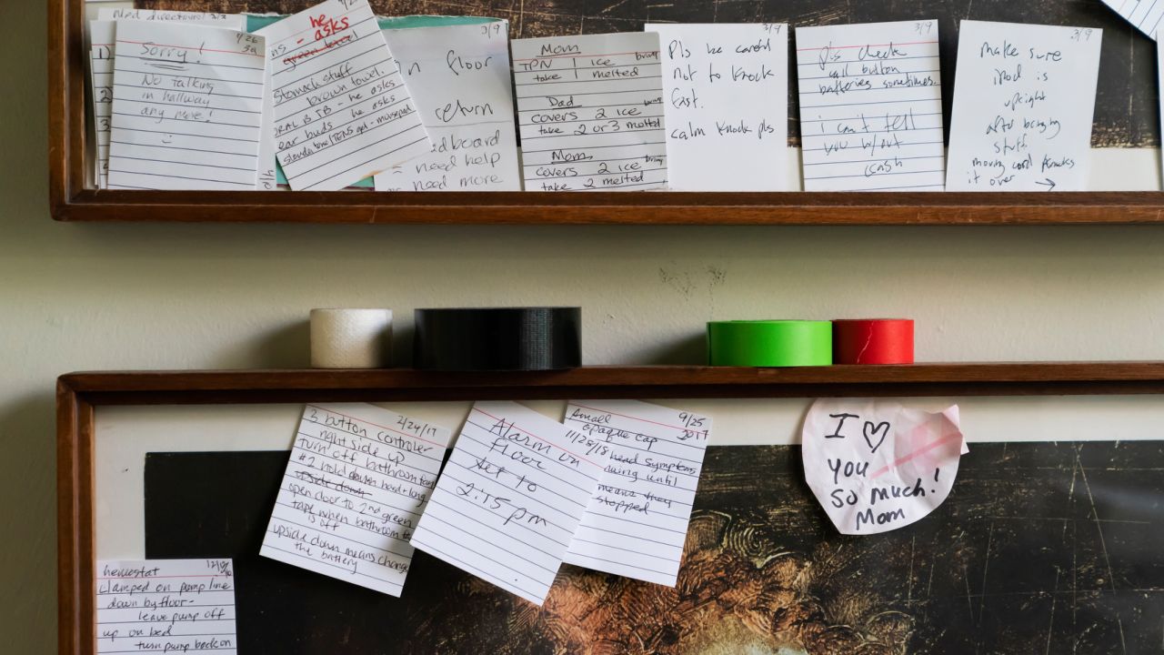 Notes posted outside Whitney's bedroom door offer reminders about his treatment.