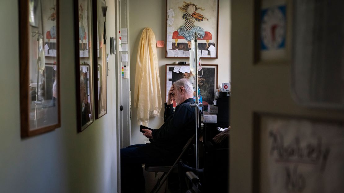 Davis waits outside Whitney's bedroom door for a signal that it's ok to go in.