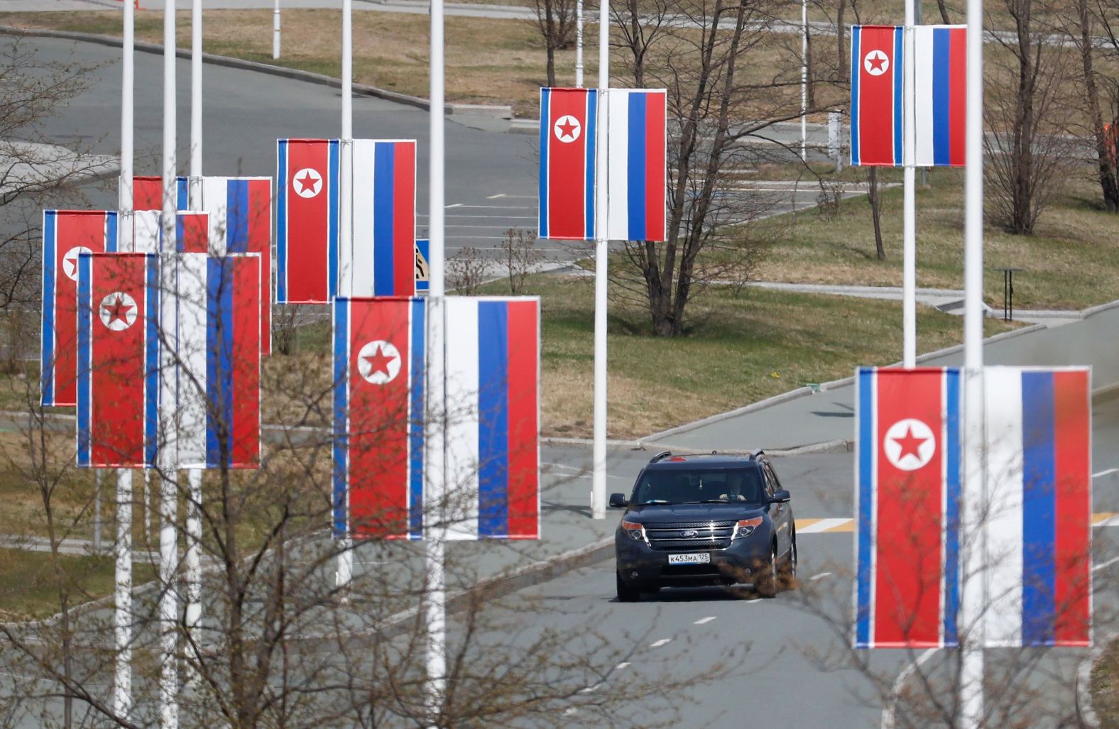 Russian and North Korean flags are seen along a road prior to the meeting of North Korean leader Kim Jong Un and Russian President Vladimir Putin on Russky Island in Vladivostok, Russia, on Thursday.