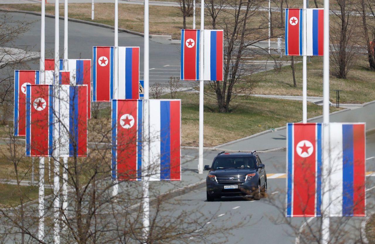 Russian and North Korean flags are seen along a road prior to the meeting of North Korean leader Kim Jong Un and Russian President Vladimir Putin on Russky Island in Vladivostok, Russia, on Thursday.