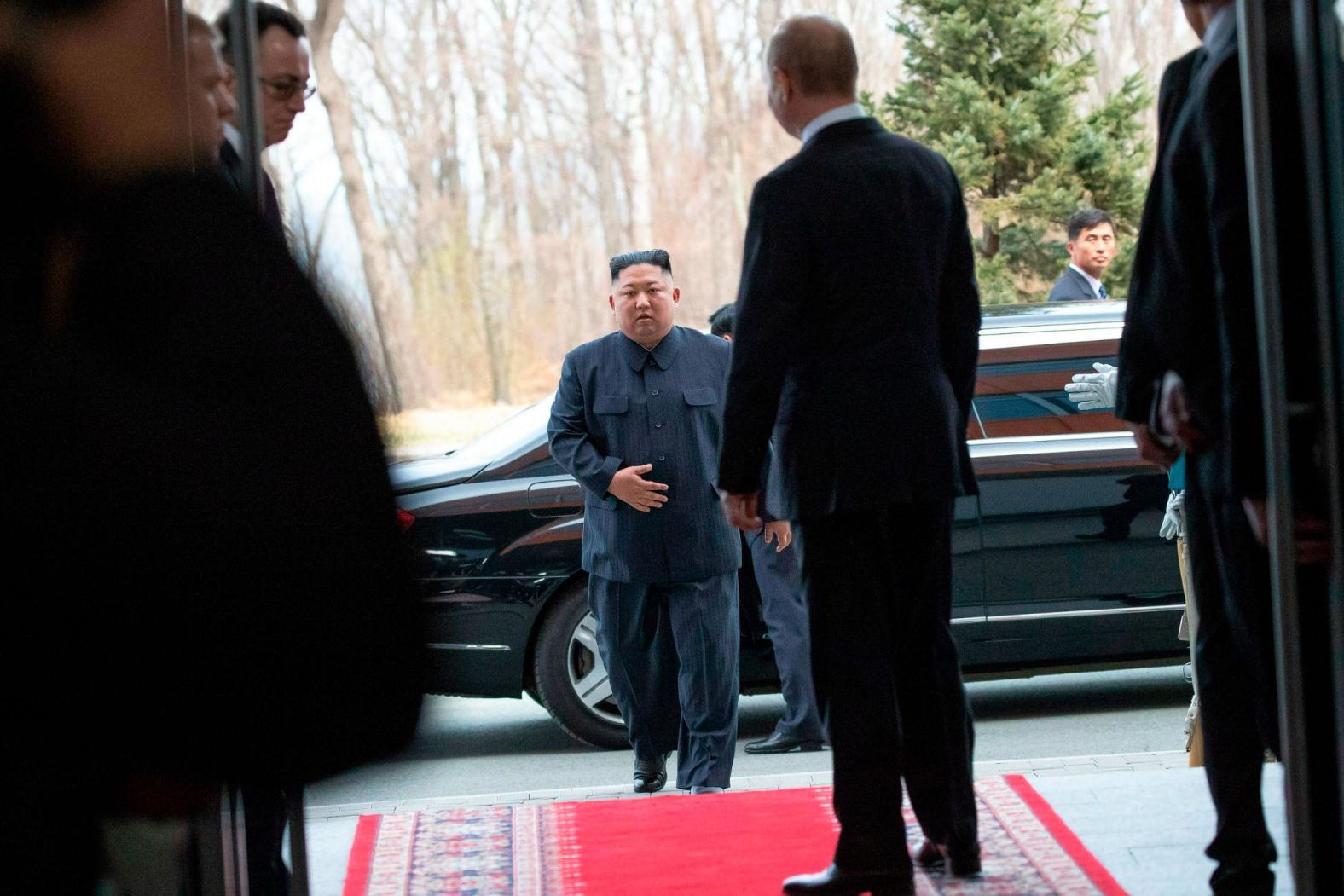 North Korea's leader Kim Jong Un, center, arrives for talks with Russian President Vladimir Putin, in Vladivostok, Russia, on Thursday, April 25.