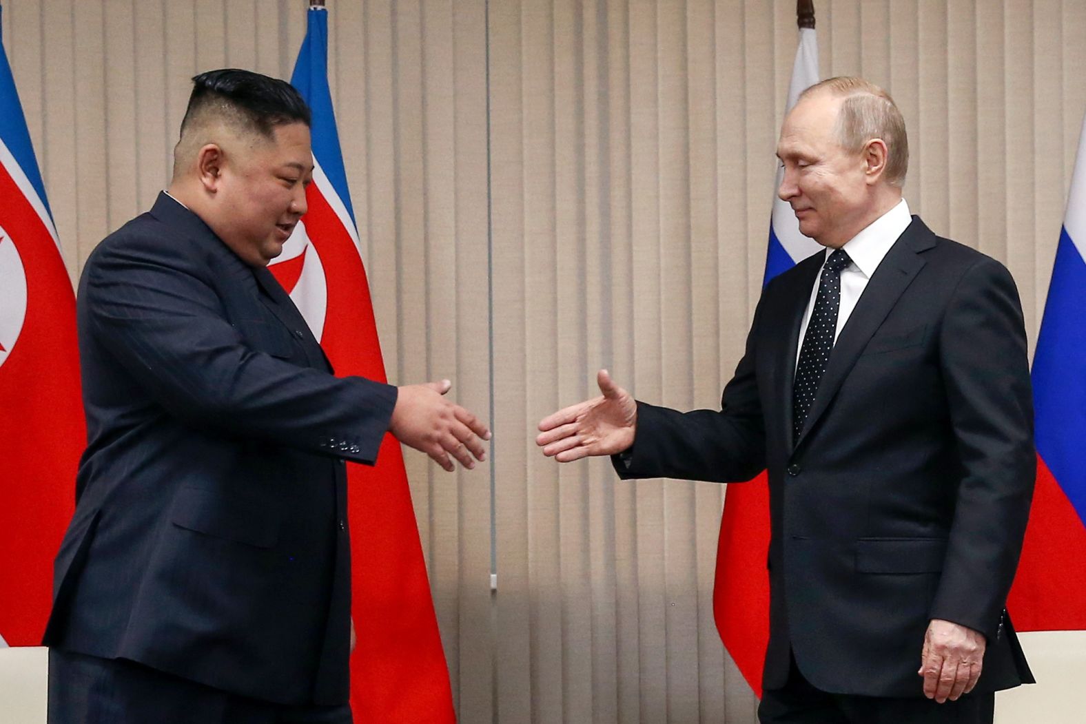 North Korean Leader Kim Jong Un, left, and Russia's President Vladimir Putin shake hands during a meeting at the Far Eastern Federal University (FEFU) on Russky Island, on Thursday.