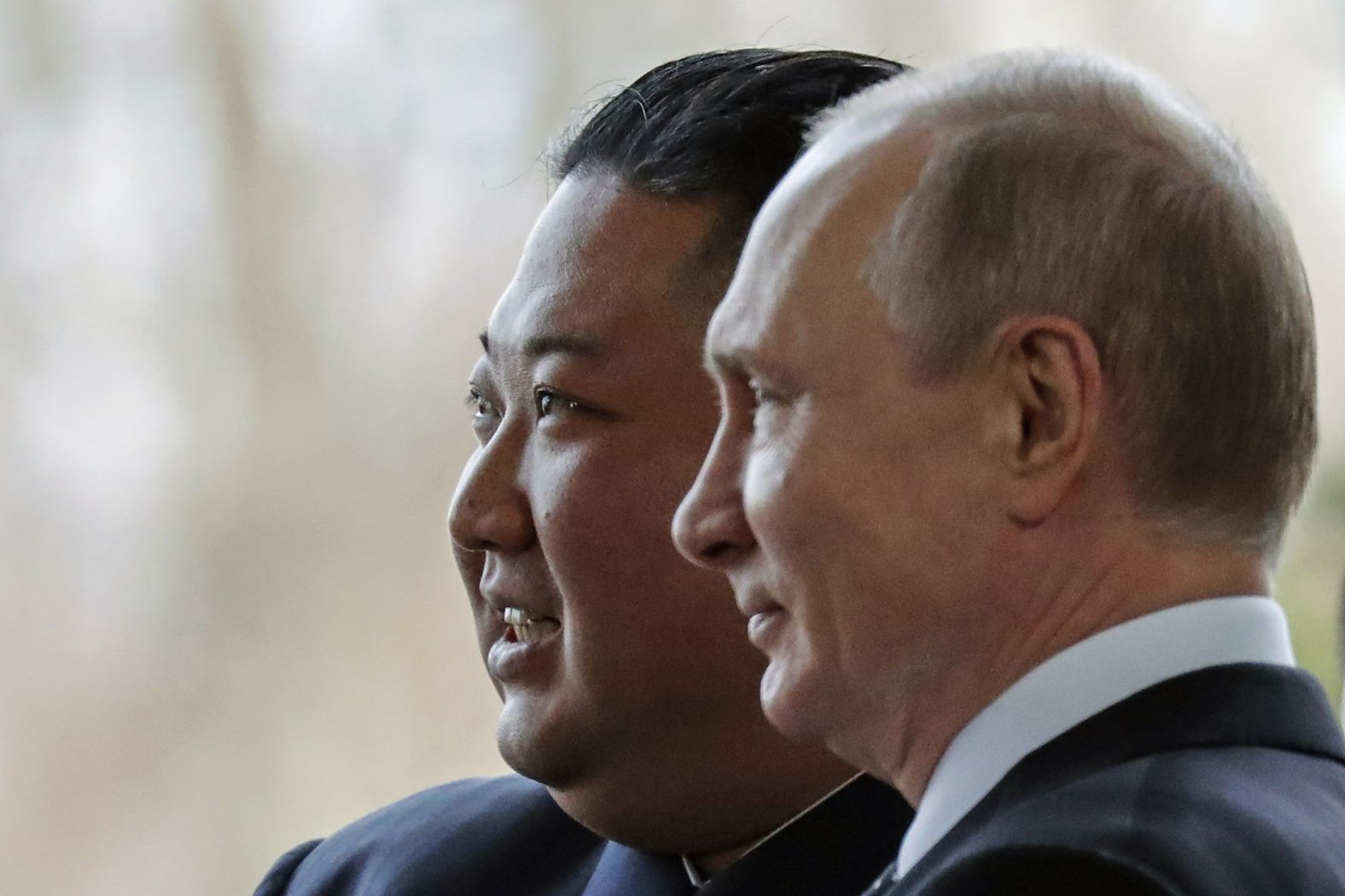 Russian President Vladimir Putin, right, and North Korea's leader Kim Jong Un pose for photographers during their meeting in Vladivostok, Russia, on Thursday.