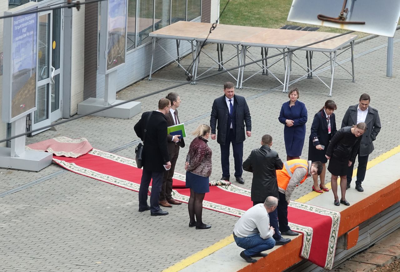 Summit officials from North Korea and Russia lay a red carpet at the railway station in Russia's far eastern city of Vladivostok on Wednesday, April 24, ahead of North Korean leader Kim Jong Un's arrival there for a summit with Russian President Vladimir Putin. 