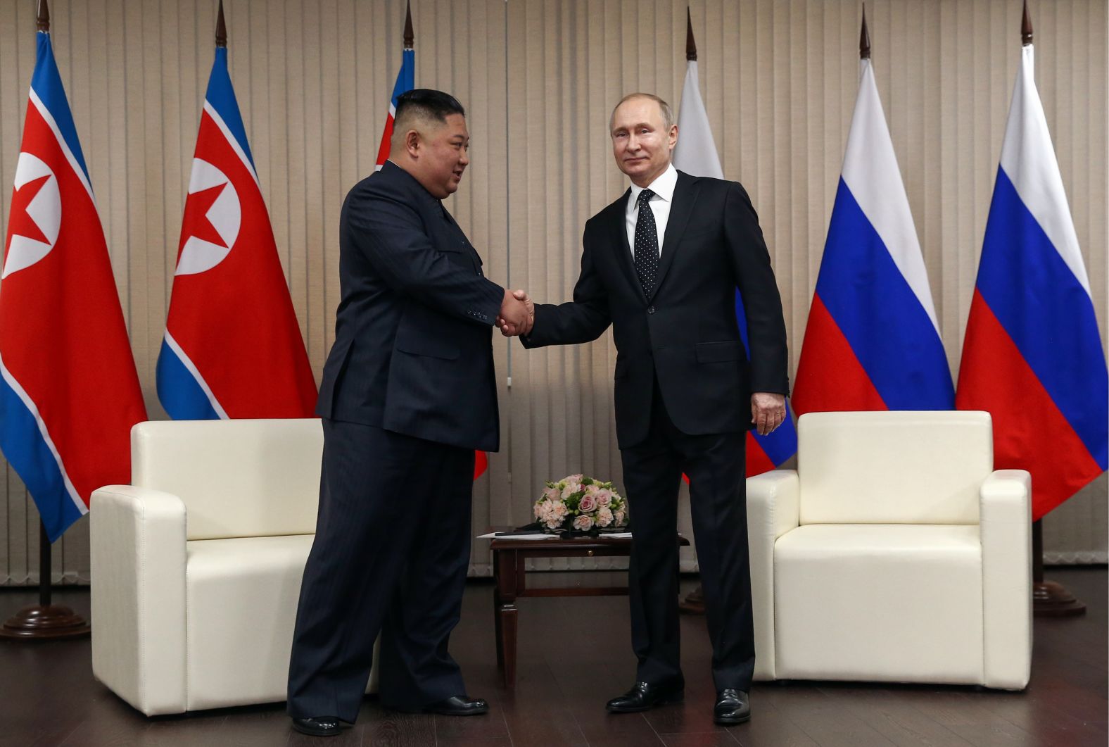 North Korean Leader Kim Jong Un, left, and Russia's President Vladimir Putin shake hands during a meeting at the Far Eastern Federal University (FEFU) on Russky Island, on Thursday, April 25.