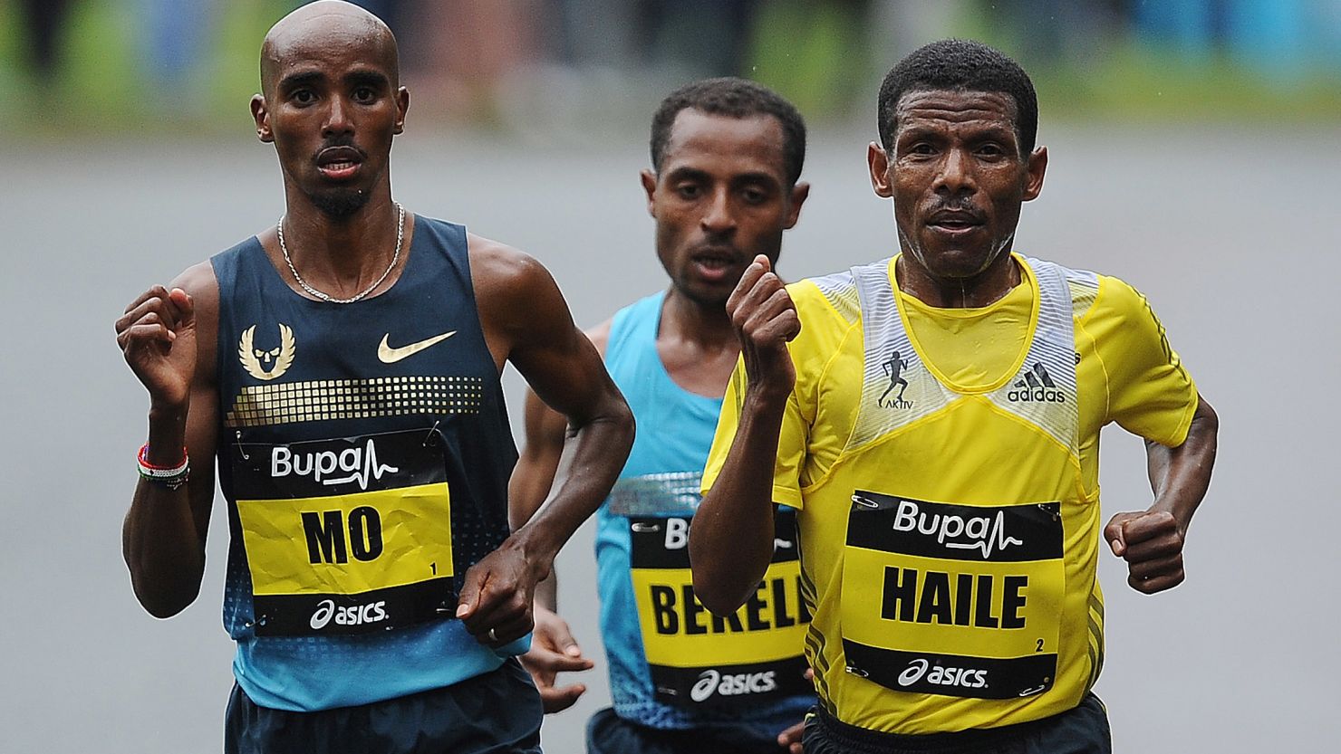 Farah  (L) competes alongside Gebrselassie at the 2013 Great North Run.