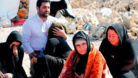 Iranians mourn after a 2017 earthquake in Kermanshah province. Iran was the fifth most negative country last year, a global survey found.