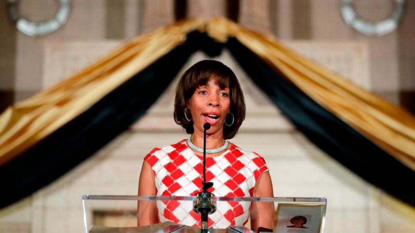 FILE - In this Dec. 6, 2016, file photo, Baltimore Mayor Catherine Pugh delivers an address during her inauguration ceremony inside the War Memorial Building in Baltimore. A spokesman for the embattled mayor of Baltimore says she'll return from her leave of absence as soon as her health allows. Spokesman James Bentley told The Baltimore Sun on Saturday, April 6, 2019, that Pugh's health is improving. It's unclear when she'll return. Pugh abruptly took her leave last week to recover from pneumonia. Meanwhile, a scandal involving her sale of children's books to high-profile clients has intensified.  (AP Photo/Patrick Semansky, File)
