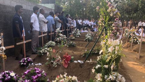 Mourners pay their respects to victims from the St Sebastian's Church attack.