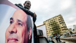 A supporter of Egyptian President Abdel Fattah el-Sisi stands in the back of a pickup truck bearing his portrait and loudspeakers, in the capital Cairo's Tahrir square on January 25, 2018, as the country marks the seventh anniversary of the 2011 uprising that ended the 30-year reign of former President Hosni Mubarak. / AFP PHOTO / MOHAMED EL-SHAHED        (Photo credit should read MOHAMED EL-SHAHED/AFP/Getty Images)
