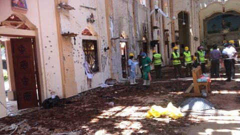 In the days after the bombing, forensic experts sift through the aftermath at St Sebastian's Church.