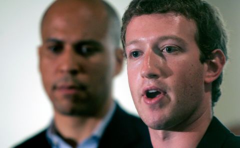 Booker stands behind Facebook CEO Mark Zuckerberg, who <a href="http://www.cnn.com/2010/TECH/social.media/09/24/facebook.donation/index.html" target="_blank">donated $100 million</a> to help improve public schools in Newark. His donation was the first grant handed out by his new foundation, Startup: Education. The foundation is focused on bettering education in the United States.