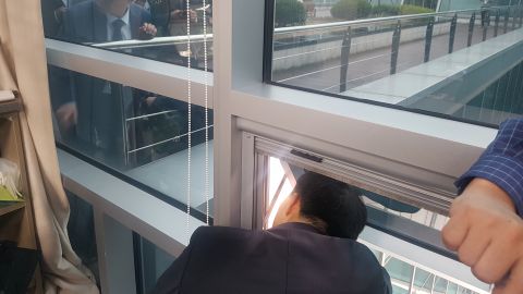 Chae and four aides were trapped in the office for over six hours.