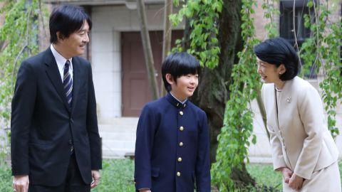 Japan's Prince Hisahito with his parents, Prince Akishino and Princess Kiko,  before attending the entrance ceremony at Ochanomizu University junior high school in Tokyo on April 8, 2019. 