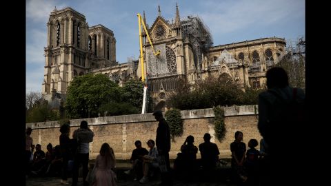 Workers in Paris cover one of the stained-glass windows of the Notre Dame Cathedral on Sunday, April 21. <a href="https://www.cnn.com/2019/04/15/world/notre-dame-cathedral-fire/index.html" target="_blank">A catastrophic fire</a> engulfed the 850-year-old cathedral last week, destroying its iconic spire and roof. <a href="https://www.cnn.com/interactive/2019/04/world/paris-notre-dame-cnnphotos/index.html" target="_blank">Related story: Paris after the smoke cleared</a>
