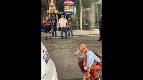Shaymaa Ismaa'eel was in Washington, attending a conference of the Islamic Circle of North America, when she saw a group of protesters holding signs against the Muslim faith and the Prophet Muhammad on Sunday, April 21. She asked her friend to take a picture of her while she flashed a smile squatting in front of them, <a href="https://www.cnn.com/2019/04/24/us/woman-smiling-photo-islamophobic-trnd-scli-intl/index.html" target="_blank">and the photo went viral.</a> "I really wanted to combat their hatred with kindness honestly," Ismaa'eel told CNN via Instagram.