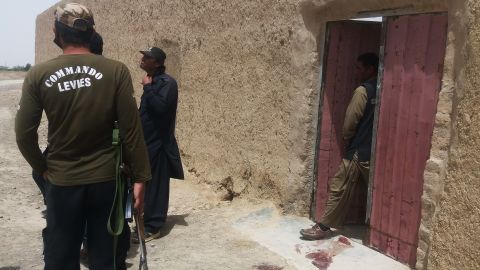 Pakistani security officials gather at the site of an attack by gunmen on a polio vaccination team in Balochistan province on Thursday.