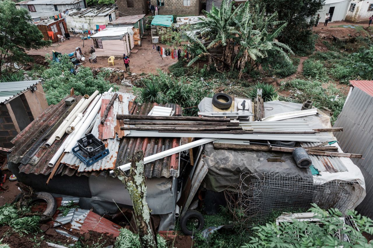 Debris remains on roofs at an informal settlement of BottleBrush on April 23. 