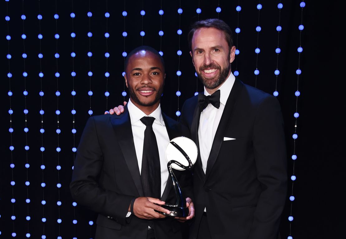 Raheem Sterling poses alongside England manager Gareth Southgate, who handed the winger his special award.