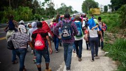 Central American migrants heading to the US walk in caravan along the road between Metapa and Tapachula in Mexico on April 12, 2019. - A group of 350 Central American migrants forced their way into Mexico Friday, authorities said, as a new caravan of around 2,500 people arrived -- news sure to draw the attention of US President Donald Trump. Mexico's National Migration Institute said some members of the caravan had a "hostile attitude" and had attacked local police in the southern town of Metapa de Dominguez after crossing the border from Guatemala. (Photo by PEP COMPANYS / AFP)        (Photo credit should read PEP COMPANYS/AFP/Getty Images)