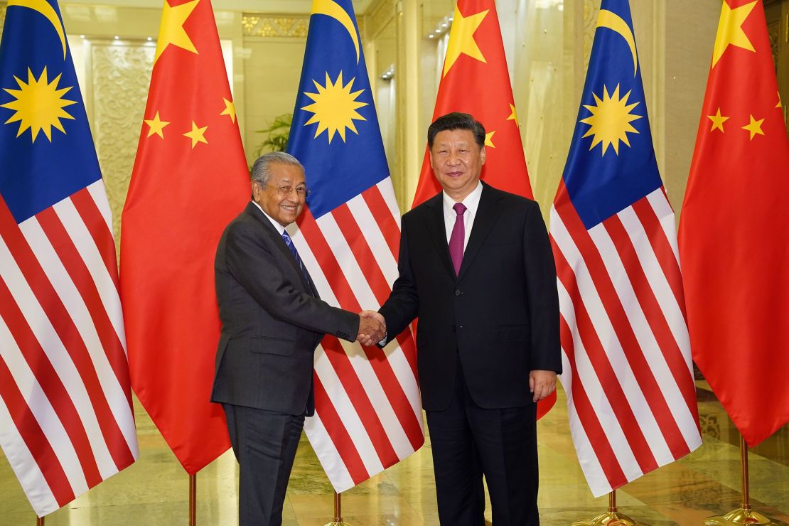 Malaysia Prime Minister Mahathir Mohamad shakes hands with President of the People's Republic of China Xi Jinping at the Diaoyutai State Guesthouse in Beijing on April 25.
