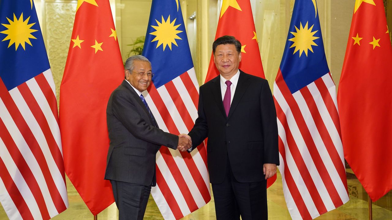 Malaysia Prime Minister Mahathir Mohamad shakes hands with President of the People's Republic of China Xi Jinping at the Diaoyutai State Guesthouse in Beijing on April 25.