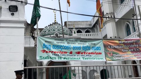 Signs outside the Dewatagaha Mosque in Colombo denounce the Easter Sunday attacks.