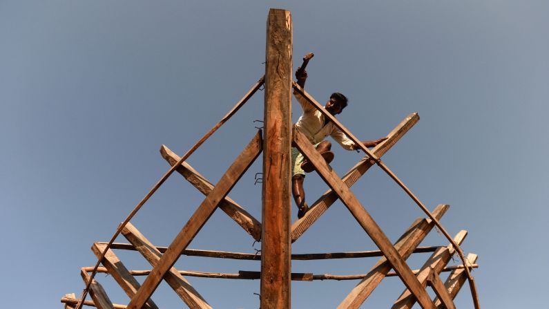 <strong>Chennai:</strong>  A carpenter works on a boat at a construction yard in Chennai. In 1923, the first May Day rally in India was held in this city on the southeast coast, back when it was called Madras. While the city is known for automobile manufacturing and IT services, traditional industries such as fishing still play a role.