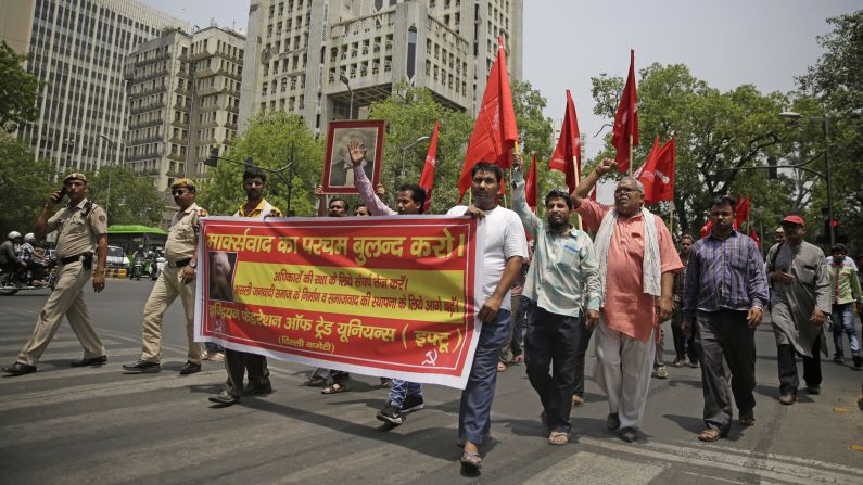 <strong>New Delhi:</strong> Workers and activists march during a rally led by the Indian Federation of Trade Unions to mark May Day. Their banner in Hindi reads, "Hold high the banner of Marxism, socialism and world peace." <a  target="_top" href="/newspapers?url=https://www.cnn.com/travel/article/delhi-attractions-india/index.html" target="_blank">Read about Delhi's top attractions here.</a>