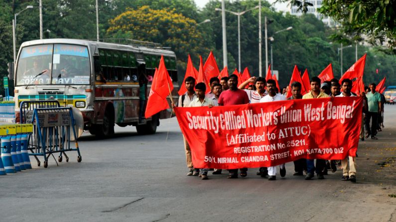 <strong>Kolkata:</strong> Members of a trade union body walk in a rally on May Day in Kolkata, the cultural capital of India and longtime center of trade union movements.