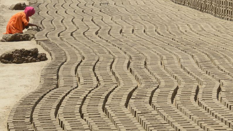 <strong>Amritsar:</strong> An Indian laborer works in a brick kiln on the outskirts of Amritsar. The city is probably best known for its Golden Temple, the holiest temple in the Sikh religion. 