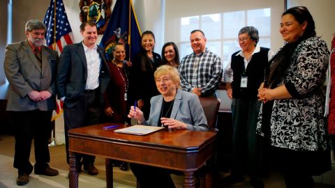 Maine Gov. Janet Mills signs a bill to establish Indigenous Peoples' Day, Friday, April 26, 2019, at the State House in Augusta, Maine. 