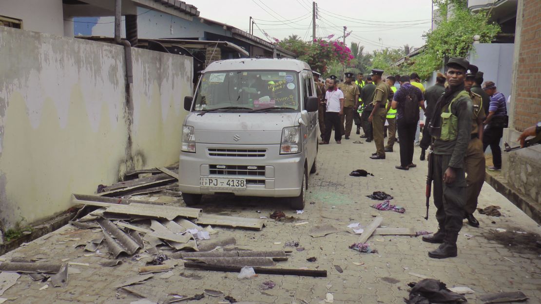 Police and soldiers secure the site of Friday night's explosion and gunbattle in eastern Sri Lanka.