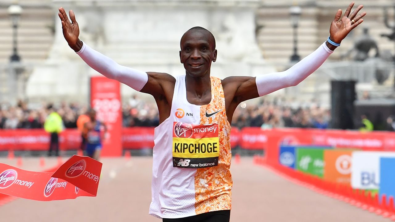Kipchoge crosses the finish line to win the London Marathon.