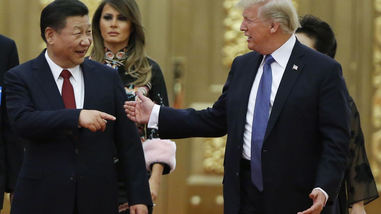 BEIJING, CHINA - NOVEMBER 9: U.S. President Donald Trump and China's President Xi Jinping arrive at a state dinner at the Great Hall of the People on November 9, 2017 in Beijing, China. Trump is on a 10-day trip to Asia.  (Photo by Thomas Peter - Pool/Getty Images)