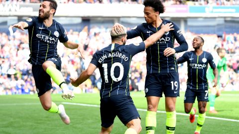 Manchester City celebrates scoring the important goal against Burnley. 