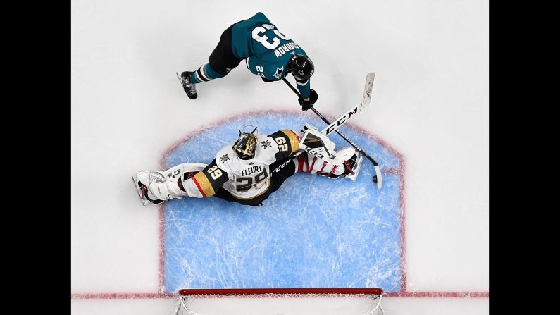 Barclay Goodrow, top, of the San Jose Sharks scores the game-winning goal against Marc-Andre Fleury of the Vegas Golden Knights in Game Seven of the Western Conference First Round during the 2019 NHL Stanley Cup Playoffs at SAP Center in San Jose, California, on Tuesday, April 23.