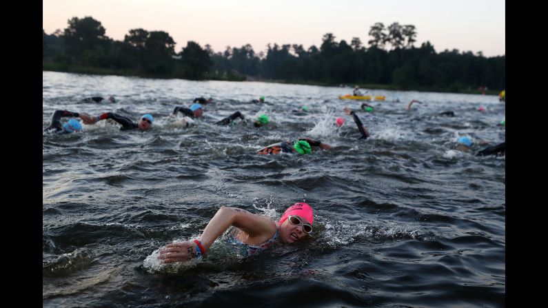 Athletes compete in the swim portion of The Memorial Hermann IRONMAN North American Championship in The Woodlands, Texas, on Saturday, April 27.