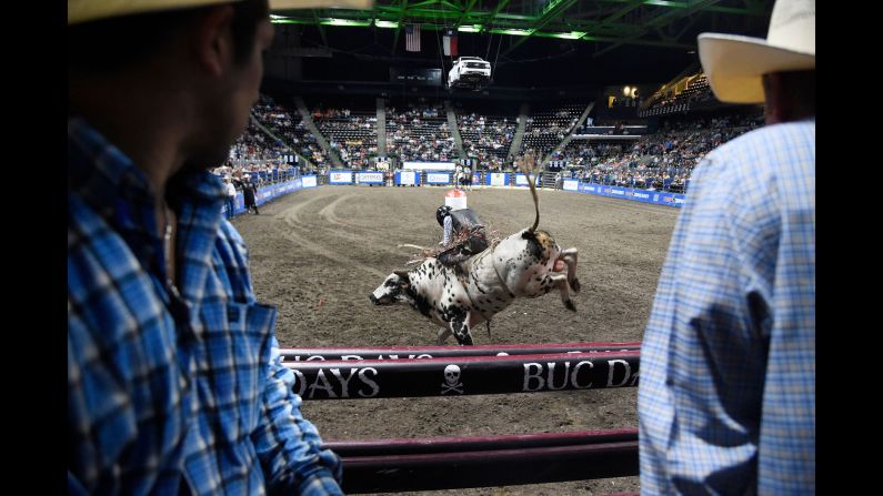 Stetson Wright rides a bull during the Corpus Christi rodeo at the American Bank Center in Corpus Christi, Texas, on Friday, April 26.
