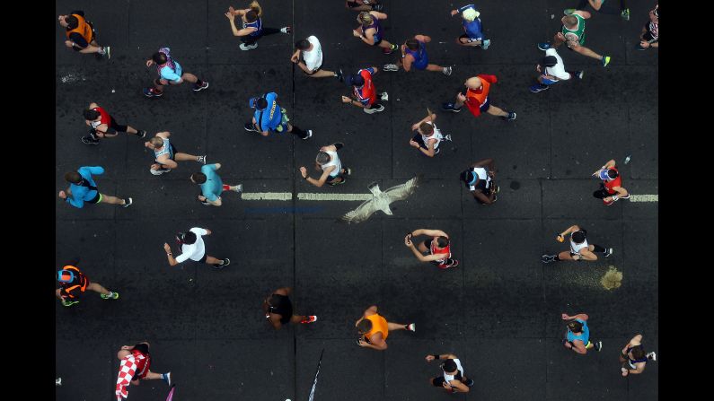 Runners of the London Marathon are seen from Tower Bridge's Glass Floor during the Virgin Money London Marathon on Sunday, April 28.