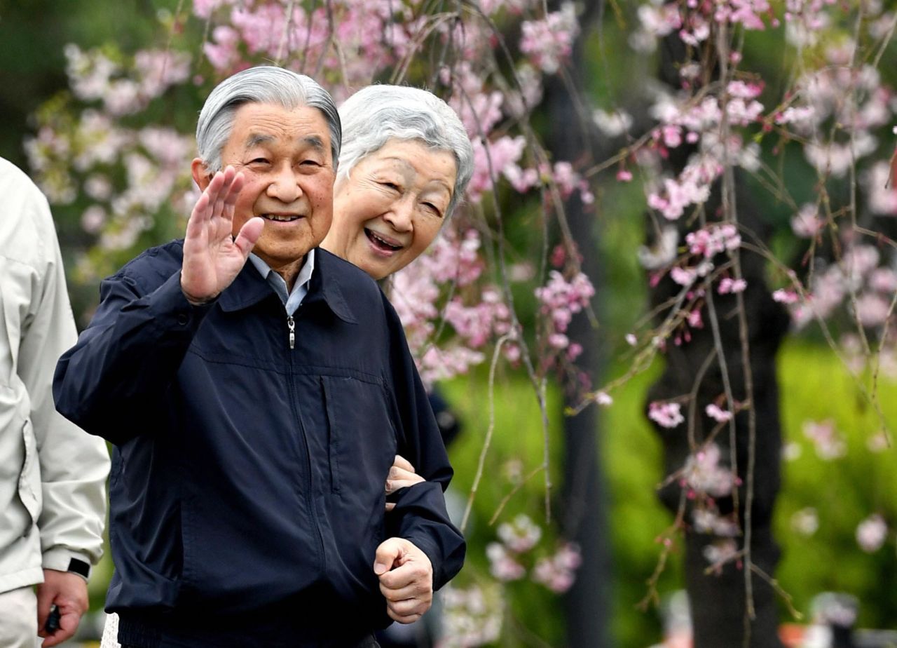 Akihito and Michiko take a brief stroll outside the Imperial Palace in Tokyo in April 2019.