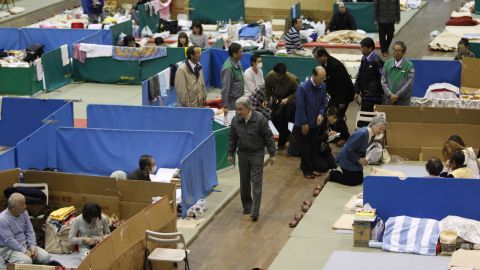 Akihito and Michiko visit an evacuation shelter after the earthquake and tsunami in 2011.